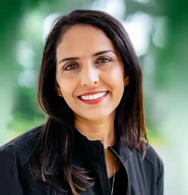 Dr. Saba Rizvi, dentist at Plantation dental practice, smiling professionally.