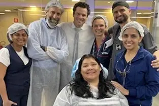 Dental team in Plantation, FL smiling together in modern practice setting.