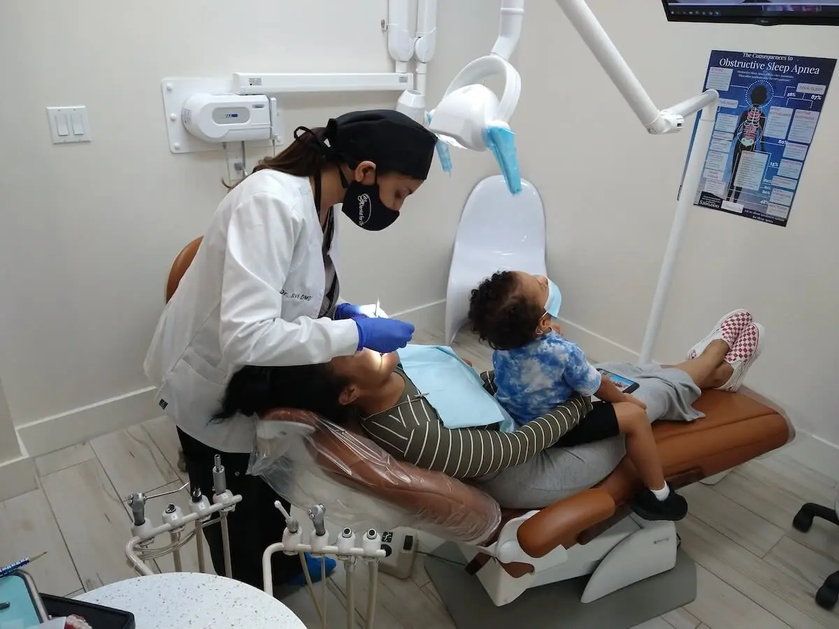 Pediatric dental patient receiving dental sealant treatment in Plantation, Florida dental office.