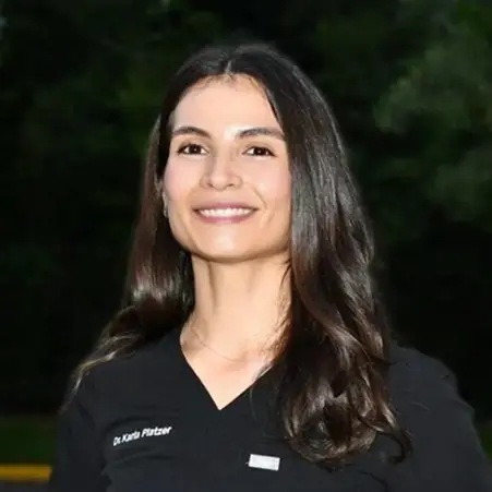 Dr. Karla Platzer, dentist at Plantation dental practice, smiling professionally.