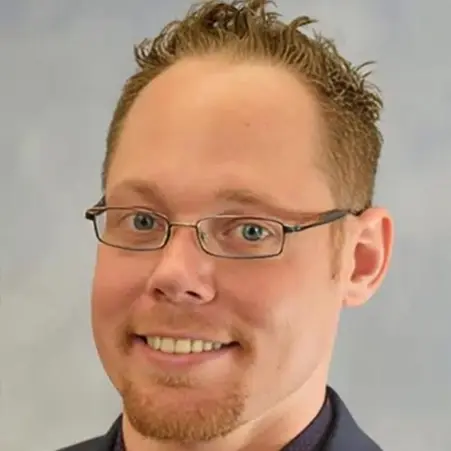 Dr. Sean McCall, dentist at Plantation dental practice, smiling in professional headshot.