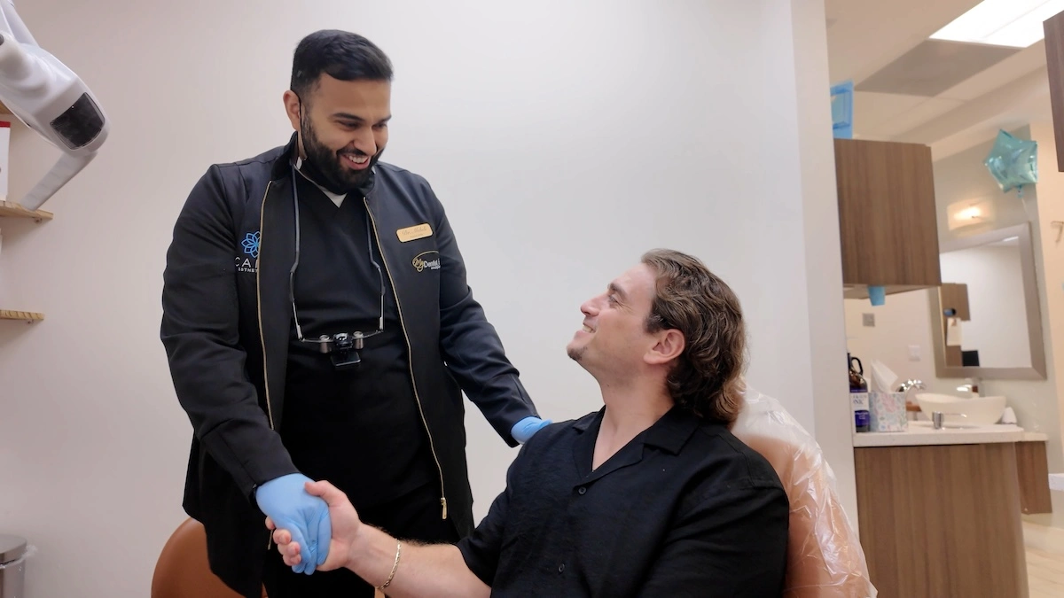 Dentist discussing dental bridge treatment with a patient