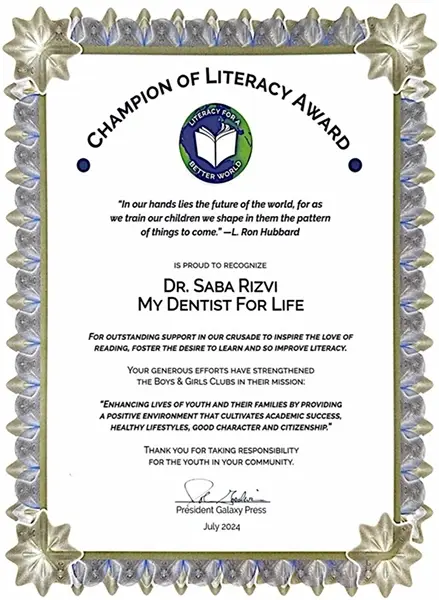 Champion of Literacy Award certificate recognizing Dr. Saba Rizvi My Dentist For Life for supporting literacy education in P.