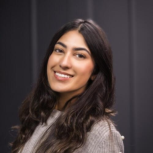 Dr. Alina Rizvi, dentist at Plantation dental practice, smiling professionally.