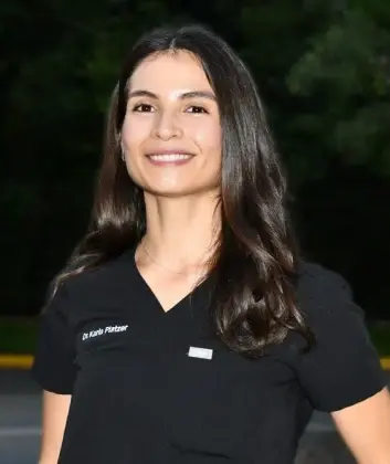 Dr. Karla Platzer, dentist at Plantation dental practice, smiling portrait.