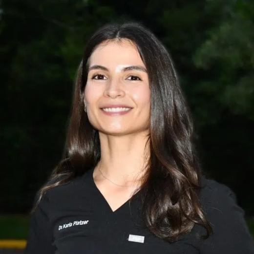 Dr. Karla Platzer, dentist at Plantation dental practice, smiling portrait.