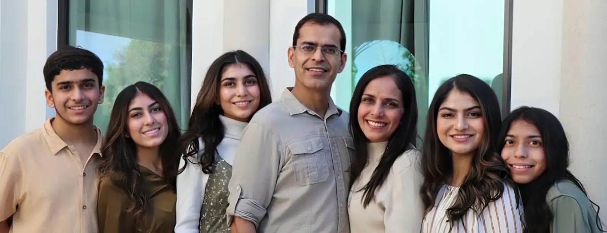 Dr. Saba Rizvi and team smiling together at dental practice in Plantation, Florida.