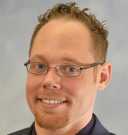 Dr. Sean McCall, dentist at Plantation dental practice, smiling portrait.