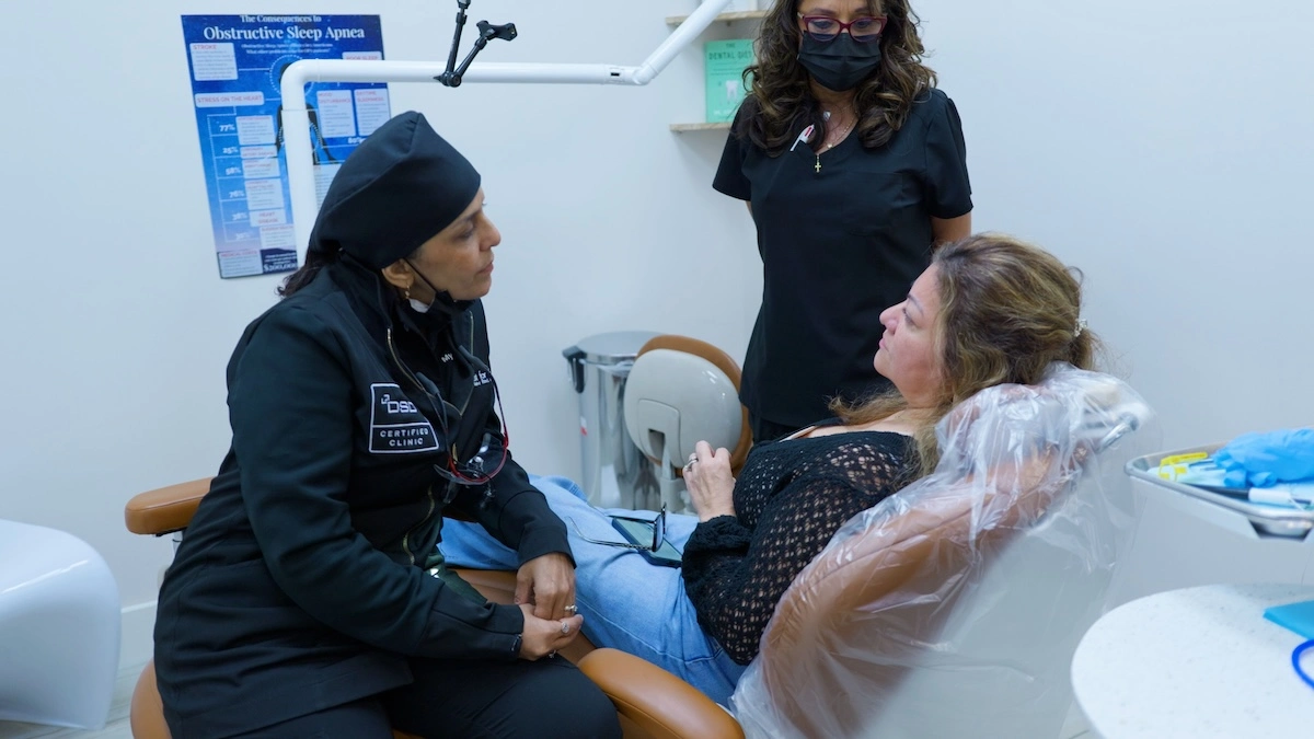 Patient receiving implant-supported dentures