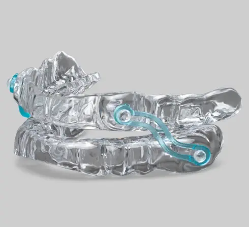 Clear dental oral appliance with turquoise adjustment straps for sleep apnea treatment in Plantation, FL.
