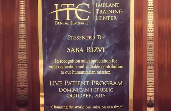 Implant Dentistry recognition certificate presented to Dr. Saba Rizvi
