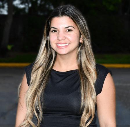 Sinthya, smiling dental team member at Plantation, Florida practice.