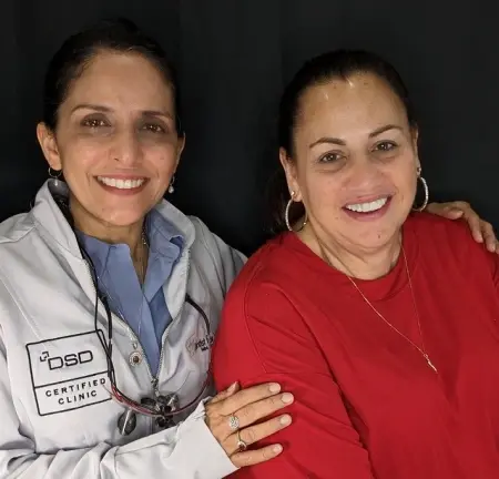 Dentist and patient smiling together at Plantation dental practice.