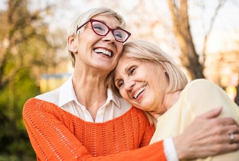 Happy senior couple smiling outdoors in Plantation, Florida.